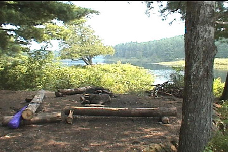 Snacktime called. 	I gave up admiring the scenery and headed back downstream to a campsite where I could stretch my legs...