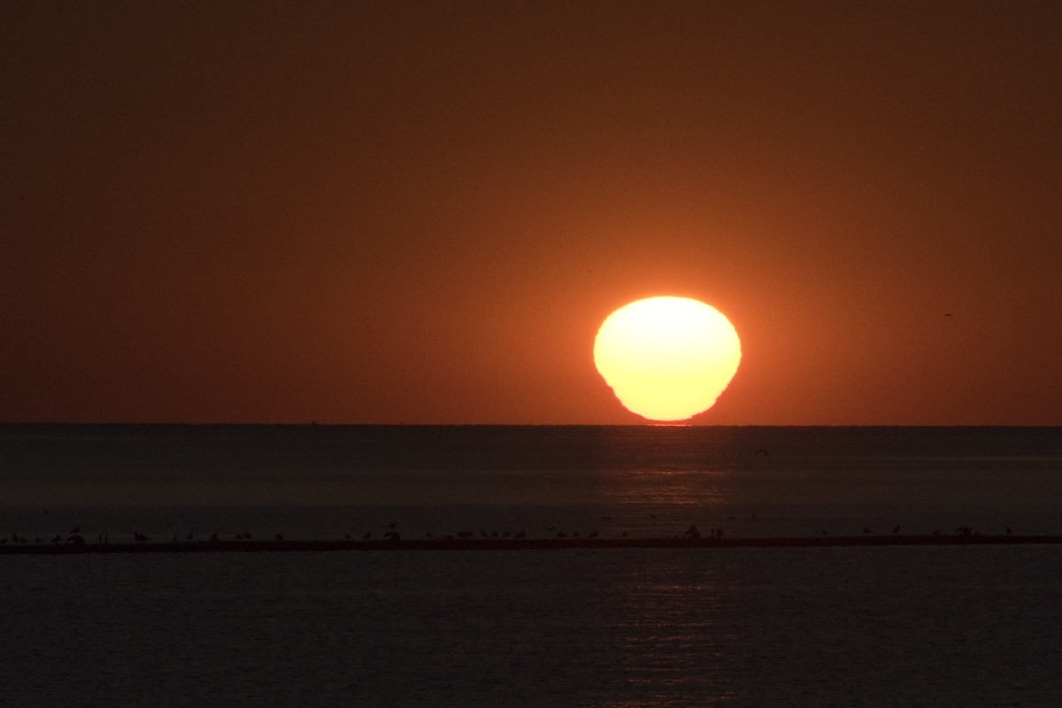 Sept. 20, 2021   As the density of hte air changes, it distorts the sperical image of the sun.