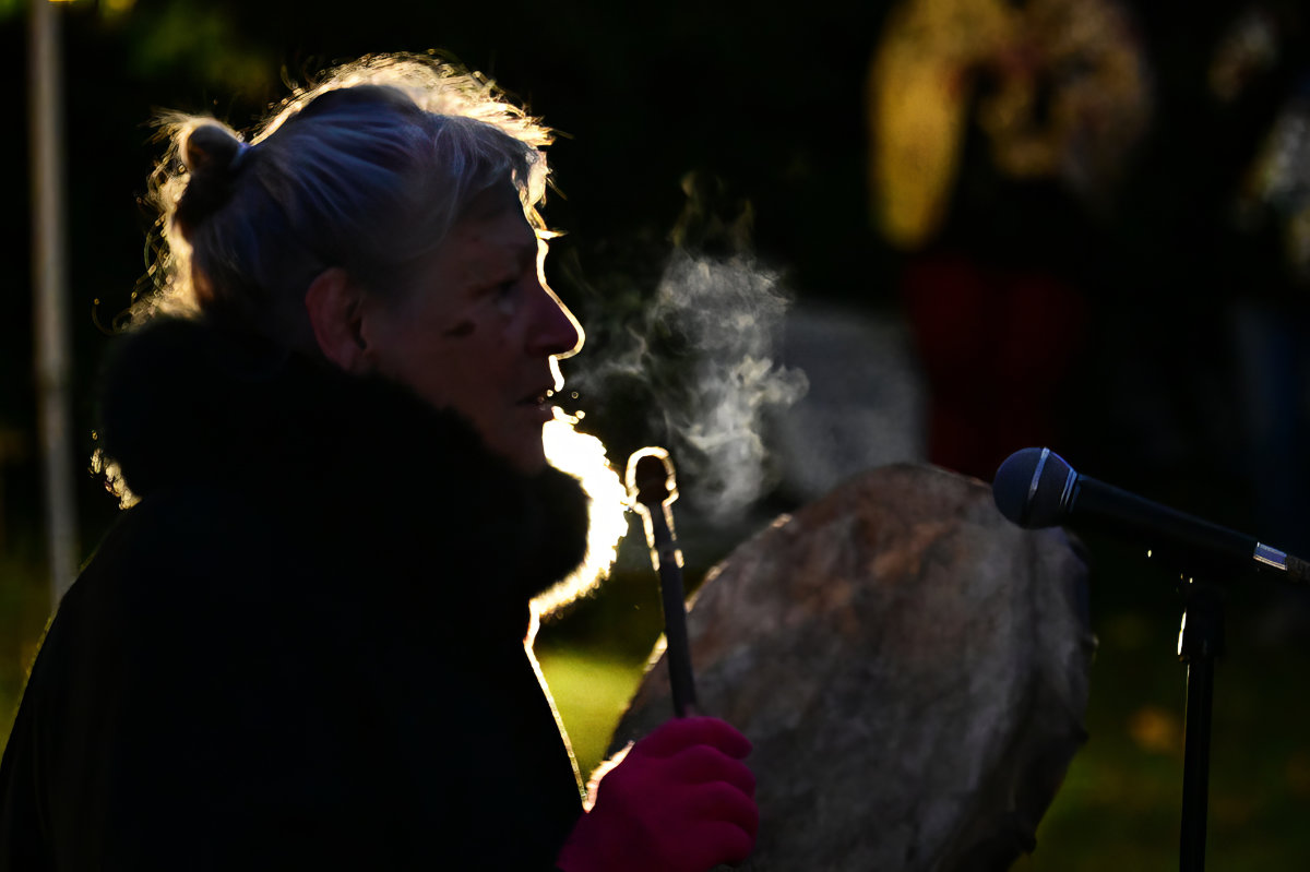 Roberta Della-Picca drumming and singing in the suddenly cold night.
