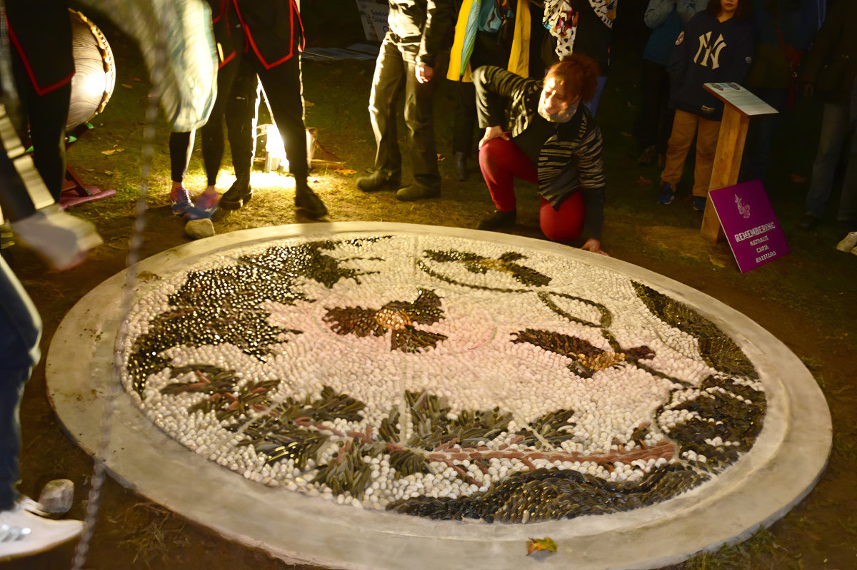 Anna Camilleri with the newly unveiled Pebble Mosaic monument.