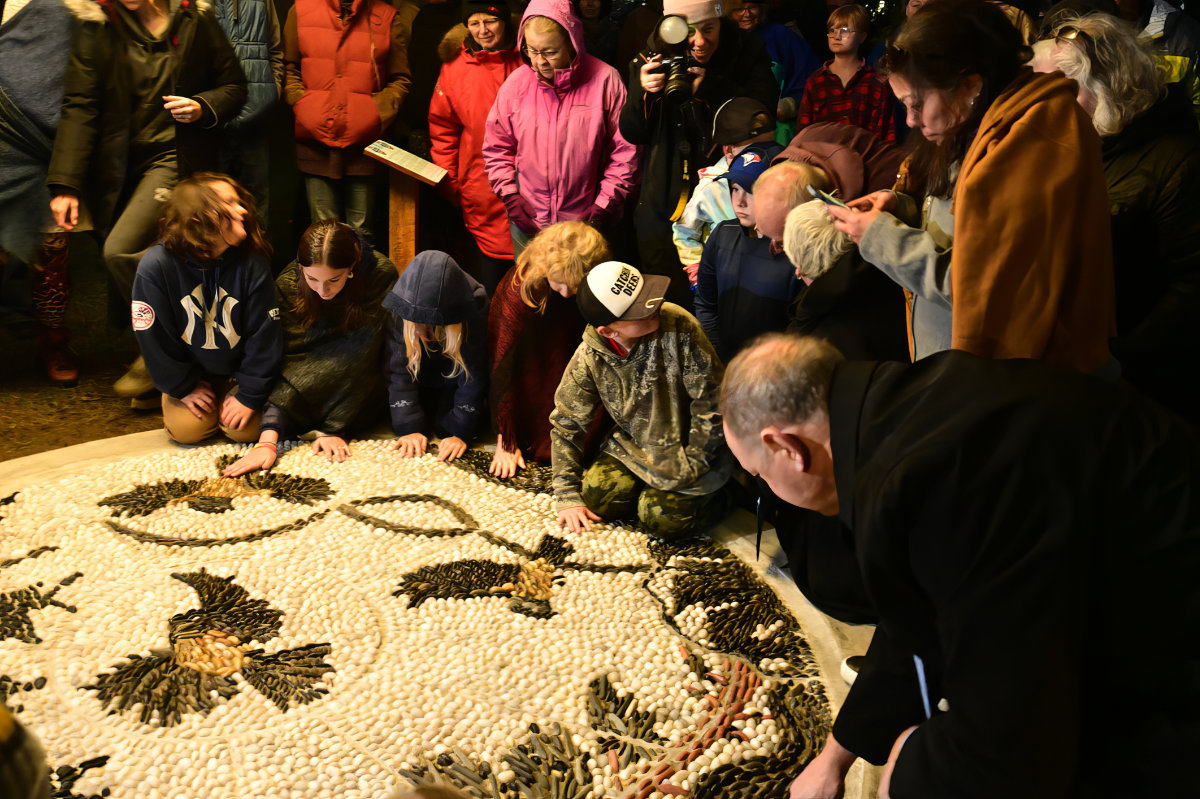 MPP John Yakabuski and Minister Charmaine Williams pay their respects.