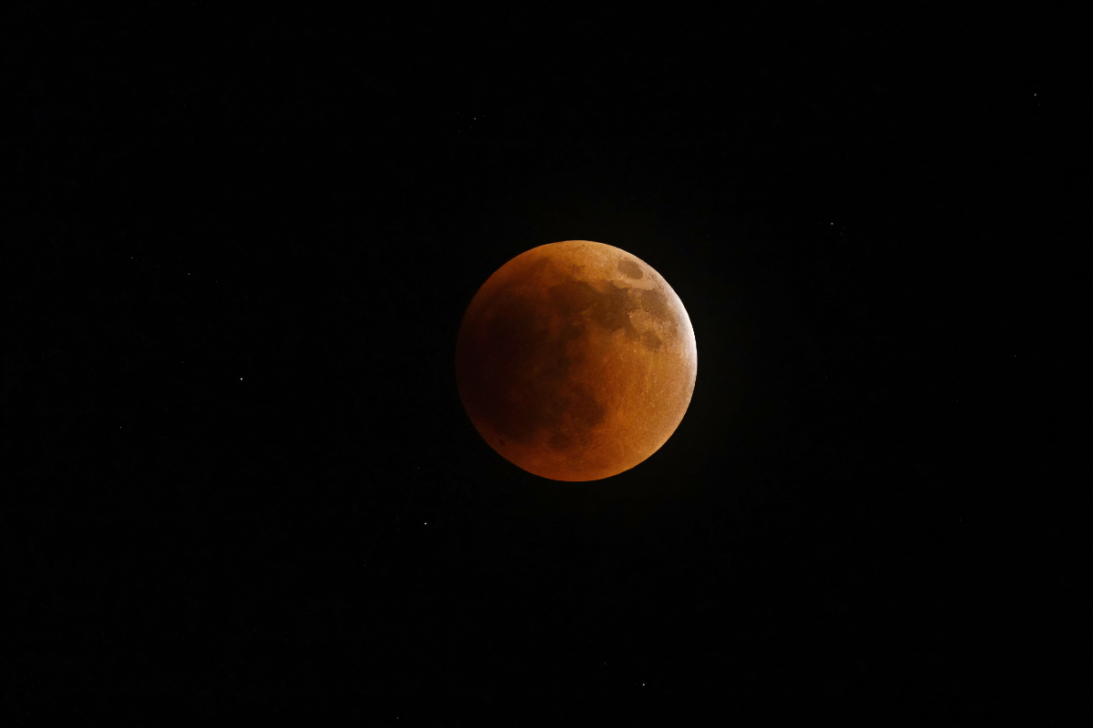 The last glimmer of bright light disappears and the moon is bathed in "sunset light".